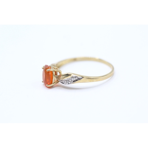 214 - 9ct gold fire opal and diamond shoulder setting ring (1.2g) Size O