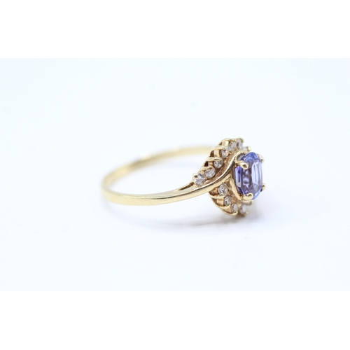 216 - 14ct gold diamond and tanzanite twist ring (2.2g) Size N