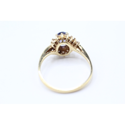 216 - 14ct gold diamond and tanzanite twist ring (2.2g) Size N