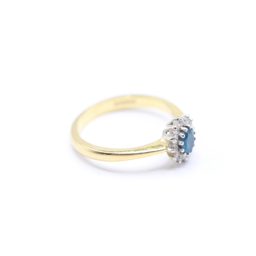 217 - 18ct gold diamond and blue gemstone halo ring (4g) Size O 1/2