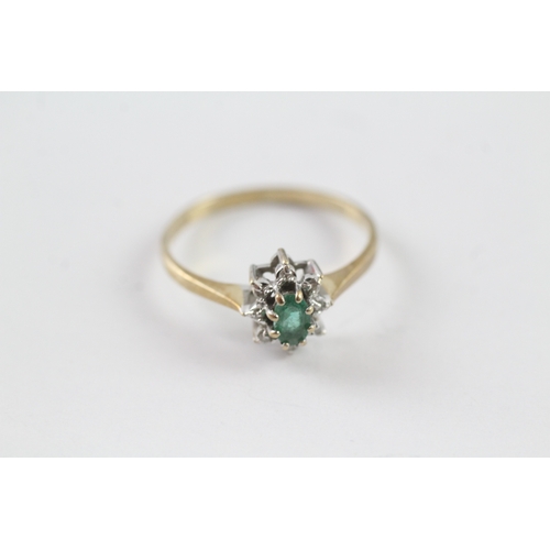 22 - 9ct gold emerald and diamond halo dress ring (1.4g) Size N