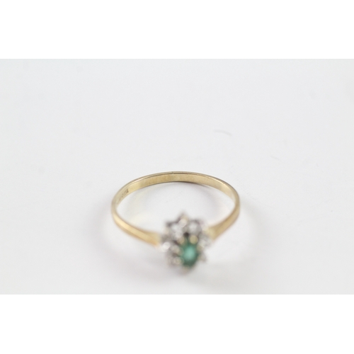 22 - 9ct gold emerald and diamond halo dress ring (1.4g) Size N