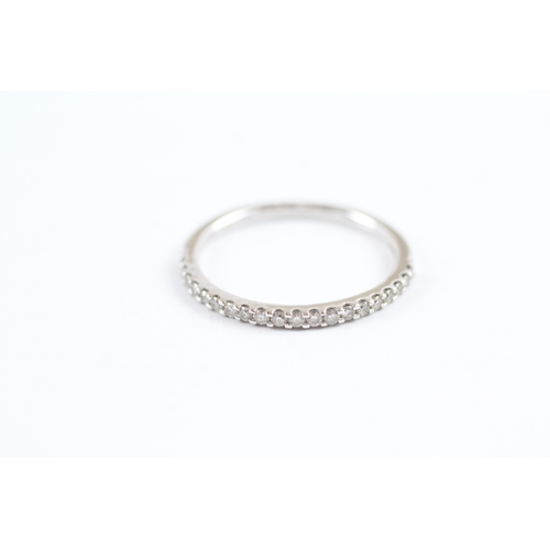 228 - 18ct white gold diamond half eternity ring (1.7g) Size L