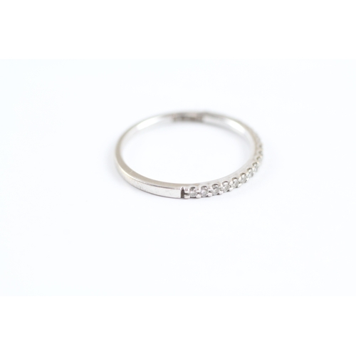 228 - 18ct white gold diamond half eternity ring (1.7g) Size L