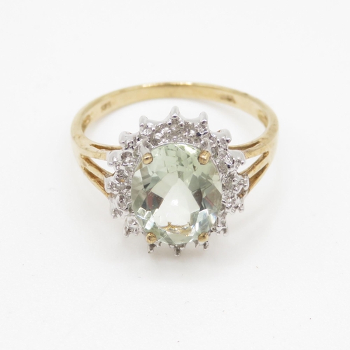 128 - 9ct gold diamond and green gemstone ring Size O 1/2 - stone 9.9mm by 7.7mm