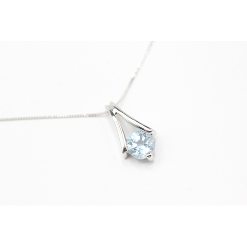 236 - 9ct white gold topaz drop pendant on chain (1.2g)