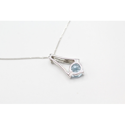 236 - 9ct white gold topaz drop pendant on chain (1.2g)