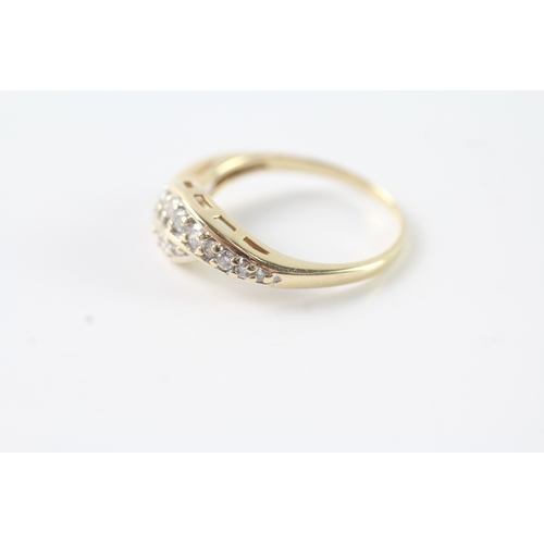 239 - 9ct gold diamond dress ring (2.9g) Size P