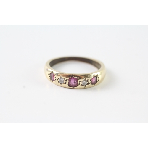 242 - 9ct gold ruby & diamond star set dress ring (2.4g) Size L