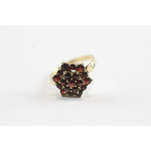 247 - 9ct gold garnet cluster cocktail ring (4.5g) Size M