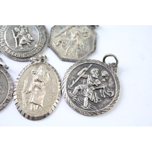 265 - Collection of Sterling Silver St Christopher Pendants inc. Georg Jensen x 7 37g