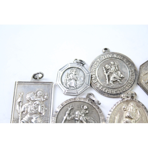 265 - Collection of Sterling Silver St Christopher Pendants inc. Georg Jensen x 7 37g