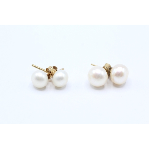 34 - 9ct gold x2 cultured pearl stud earrings (2.1g)