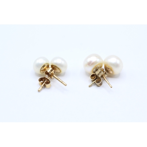 34 - 9ct gold x2 cultured pearl stud earrings (2.1g)