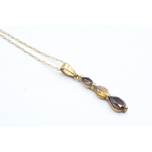 38 - 9ct gold pear cut smokey quartz and citrine set pendant necklace (1.5g)