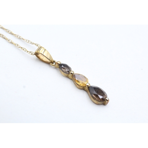 38 - 9ct gold pear cut smokey quartz and citrine set pendant necklace (1.5g)