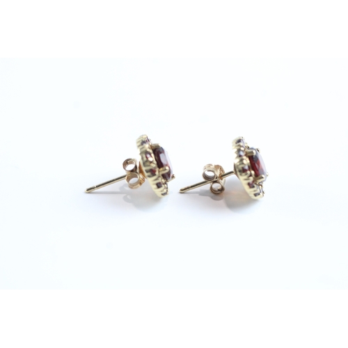 24 - 9ct gold garnet halo stud earrings (2g)