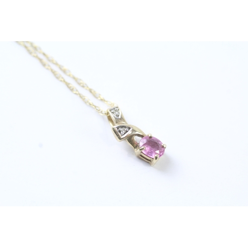 59 - 9ct gold oval cut pink sapphire & diamond pendant necklace (1.4g)