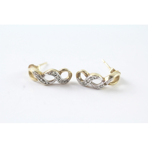 63 - 9ct gold diamond cross-over drop earrings (1.9g)