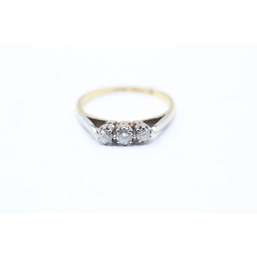 64 - 18ct gold three stone diamond ring (2.2g) Size N 1/2