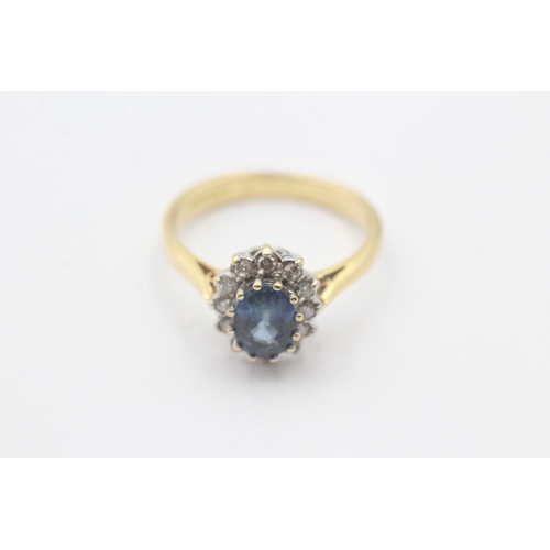 68 - 18ct gold blue gemstone and diamond halo set ring (3.9g) Size N