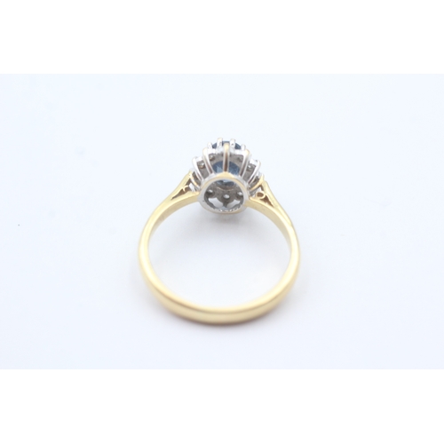 68 - 18ct gold blue gemstone and diamond halo set ring (3.9g) Size N