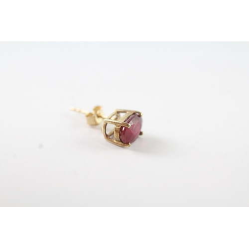 76 - 9ct gold oval cut ruby stud earrings (1.3g)