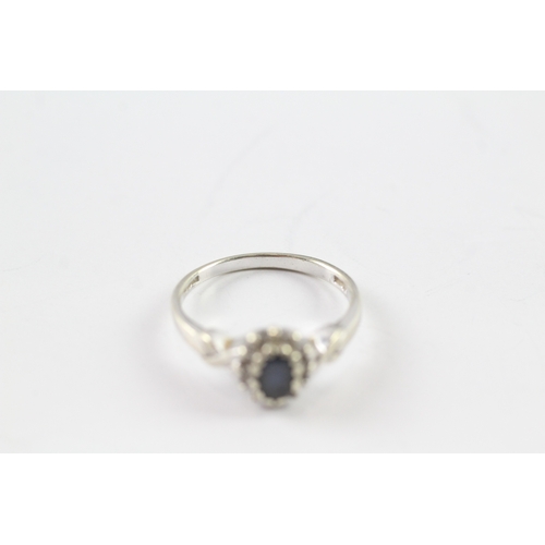 50 - 9ct white gold sapphire and diamond halo dress ring (3.2g) Size P