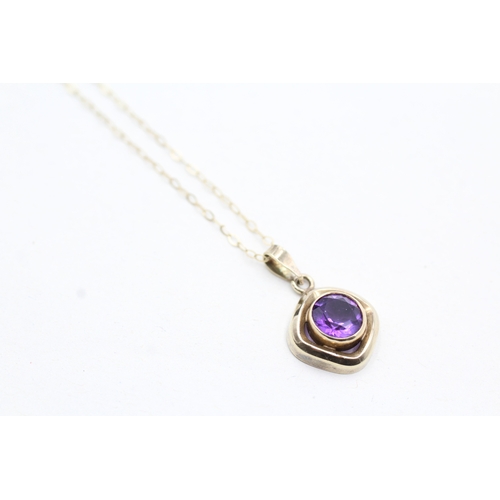 53 - 9ct gold amethyst pendant on chain (1.5g)