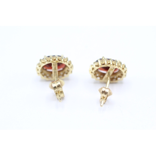 54 - 2x 9ct gold garnet & diamond stud earrings (3.2g)