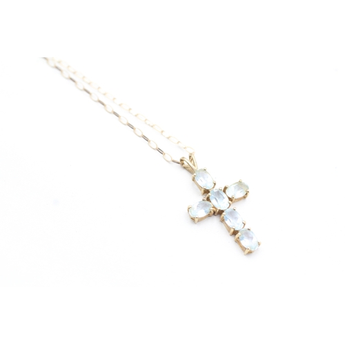 80 - 9ct gold blue topaz set cross pendant necklace (2.5g)