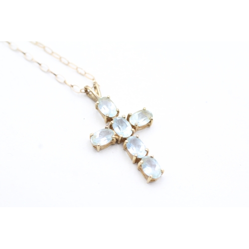 80 - 9ct gold blue topaz set cross pendant necklace (2.5g)