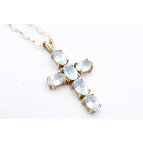 80 - 9ct gold blue topaz set cross pendant necklace (2.5g)