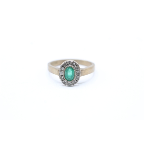 100 - 9ct gold emerald and diamond halo ring (3g) Size N