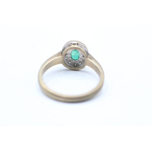 100 - 9ct gold emerald and diamond halo ring (3g) Size N