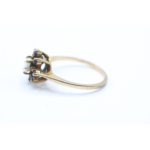 108 - 9ct gold sapphire and opal halo ring (2.7g) Size O 1/2