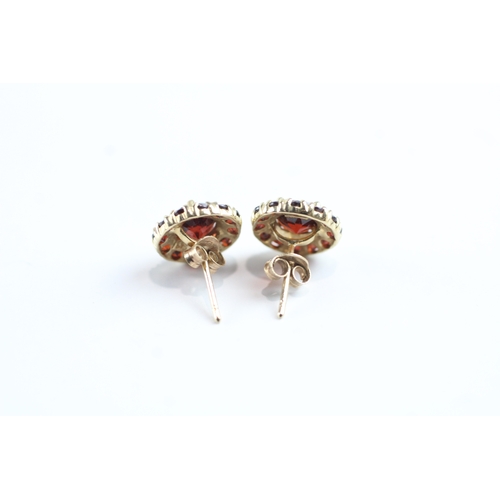 24 - 9ct gold garnet halo stud earrings (2g)