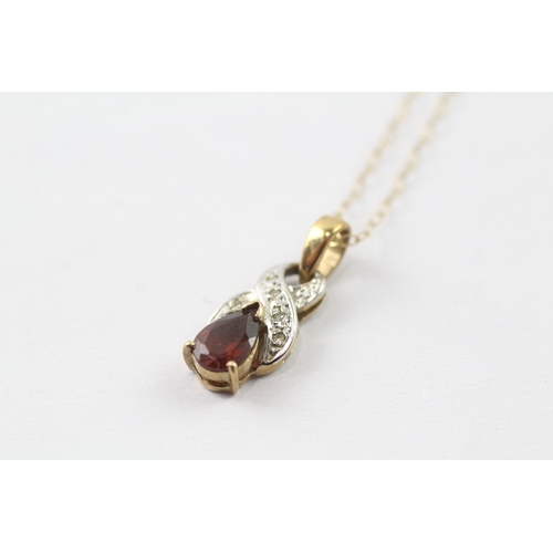 44 - 9ct gold diamond and red gemstone twist pendant on chain (1.5g)