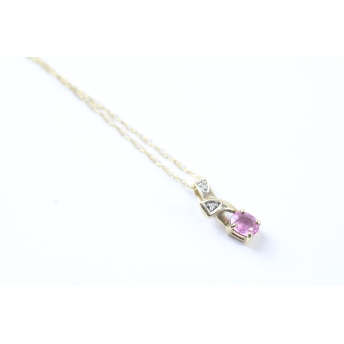 59 - 9ct gold oval cut pink sapphire & diamond pendant necklace (1.4g)