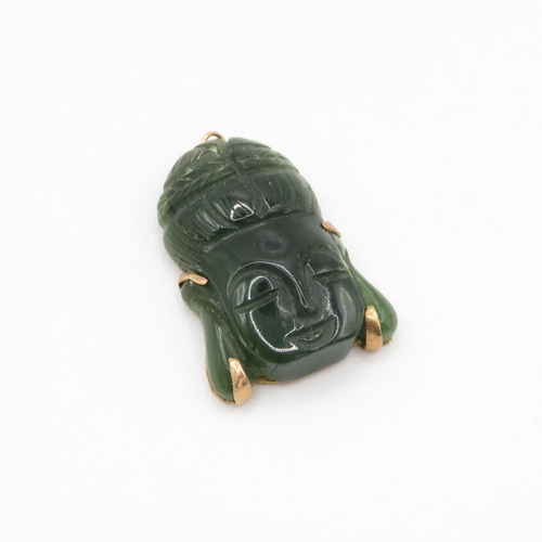 109 - 14ct gold carved nephelite buddha pendant (7.8g)