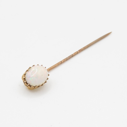 233 - 15ct gold antique cabochon cut opal tie pin with a 9ct gold pin, claw set (1.8g)