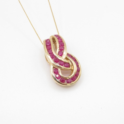 28 - 9ct gold ruby infinity knot pendant necklace (3.1g)