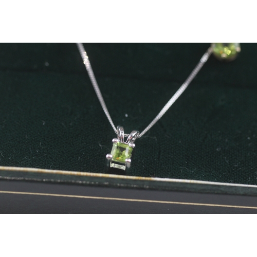 100 - 9ct white gold x2 peridot pendant necklace & stud earrings set (2.4g)