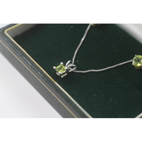 100 - 9ct white gold x2 peridot pendant necklace & stud earrings set (2.4g)