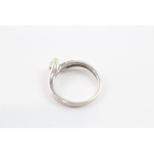 108 - 9ct white gold tension set bypass dress ring (2.4g) Size N