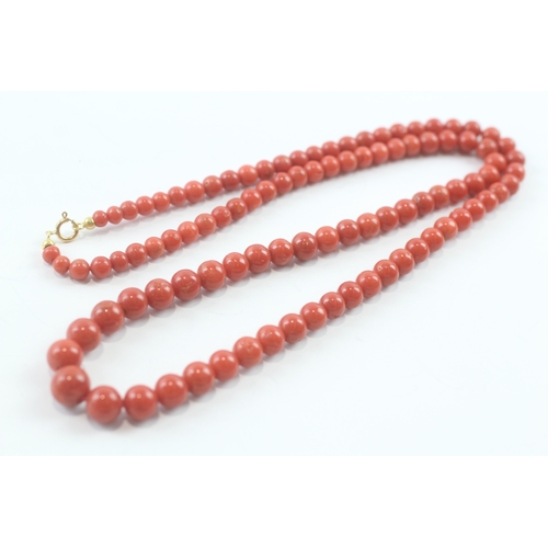 124 - 18ct gold clasped coral necklace (32.7g)