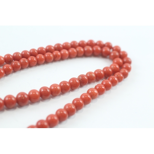 124 - 18ct gold clasped coral necklace (32.7g)