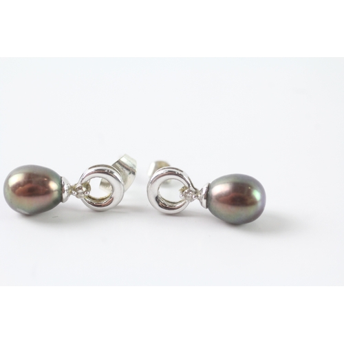 125 - 9ct white gold cultured pearl & diamond drop earring (2.6g)