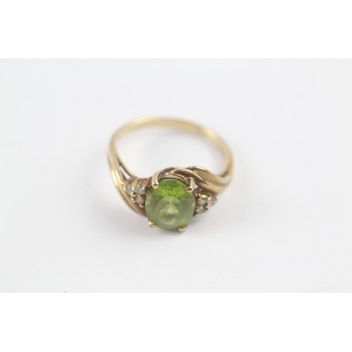 145 - 9ct gold peridot & diamond dress ring (2.6g) Size N