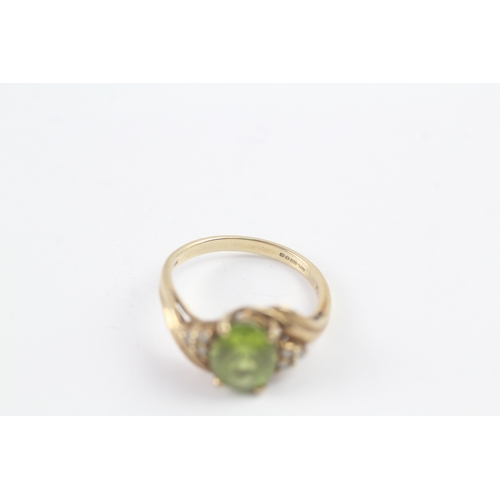 145 - 9ct gold peridot & diamond dress ring (2.6g) Size N